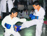 A bout in the inter-school tae kwon do championship held in Dehradun on Thursday. 