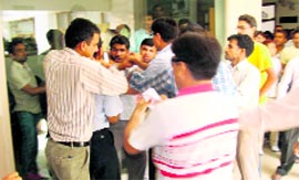 Teachers and non-teaching staff of the GJU clash outside the Vice-Chancellors office at Hisar on Thursday.
