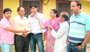Sarvjeet Soodan being congratulated by friends and relatives at his residence in RS Pura