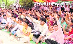 Members of the Inclusive Education Volunteers Association stage a protest outside the mini- ecretariat in Ludhiana