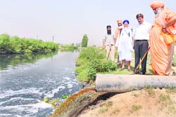 Balbir Singh Seechewal inspects the site where untreated water is flowing into the drain, in Jalandhar