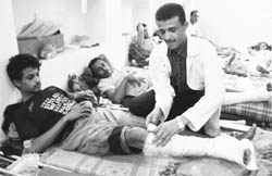 Wounded protesters receive first aid at a makeshift clinic in Taiz, near Sanaa, on Thursday