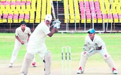 Gurdeep Singh of District Coaching Centre plays a shot during a match against St Soldiers Academy at Panchkula