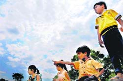 Children enjoy a cool breeze on a cloudy Friday morning in Chandigarh