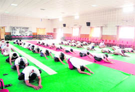 Policemen at a yoga camp in Dehradun on Friday.