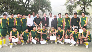 The Wynberg Allen School team with the trophy in Mussoorie on Friday.