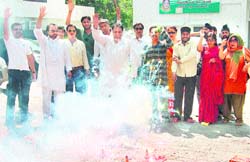 Congress workers celebrate in Dehradun after the election results were announced in Kerala, Assam and West Bengal 