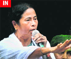 Trinamool Congress chief Mamata Banerjee addresses party workers and supporters at her Kalighat residence in Kolkata