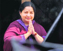 AIADMK chief J Jayalalithaa greets party supporters outside her residence in Chennai.