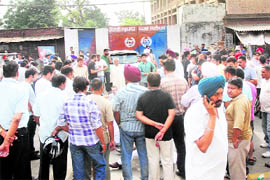 Relatives and friends of Gurkirat Singh Sekhon protest in front of the Central Jail in Jalandhar on Friday. 