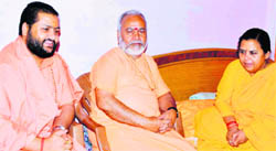 Uma Bharti is met by a former Union Minister of State for Home, Swami Chinmayanand (centre) and Maha Mandaleshwar Rameshwar Brahmachari in Haridwar on Saturday. 