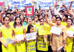 Members of an NGO hold a protest in Karnal on Saturday