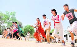 Girls participate in a race during the police recruitment rally in Ludhiana