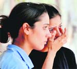 A participant breaks down after she failed to complete the last level of the physical fitness trial at the recruitment rally in Ludhiana