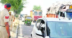Cops clear traffic following the dharna at Lodhowal Chowk in Ludhiana