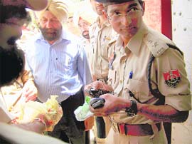 SSP Kaustubh Sharma inspects the objectionable articles seized from the Central Jail premises during a surprise check in Ferozepur 