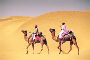 Camel rides are popular in Khimsa dunes village, Rajasthan