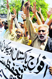 People shout pro-security forces slogans during a rally in Multan on Saturday.