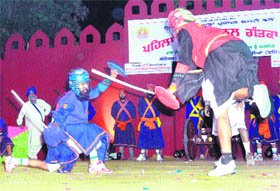 Nihangs perform during the International Gatka Cup in Fatehgarh Sahib.