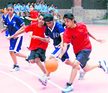 A match in the District Sub-Junior Basketball Girls Championship being played at Welham Girls' School in Dehradun on Sunday