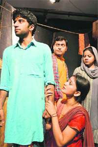 COLOURS OF DRAMA: A scene from the play 'Ghaat ki Naav', directed by Neeraj Kant, which was staged at the Natrang Theatre on Sunday.