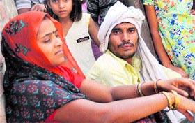Long wait Beerus father Sham Lal and mother Maya anxiously wait for their son in Ludhiana.