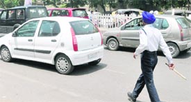 A violator in a car gives a traffic cop the slip.