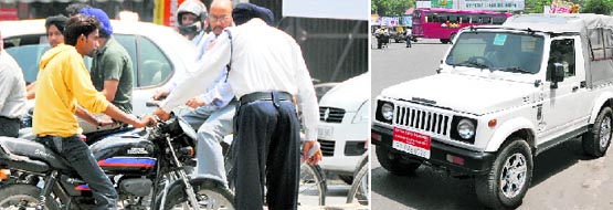 (Left)A traffic cop stops a violator after he turns on the wrong side to make an escape. (Right)In violation of the High Courts orders, number plates on many vehicles, like this one, carry the designations of officials.