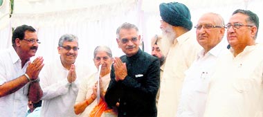 Governor Shivraj Patil along with CM Parkash Singh Badal and newly elected Ministers Kumar Jiyani, Tikshan Sud, Laxmi Kanta Chawla, Satpal Gosain and Arunesh Shaker during the oath taking ceremony at the Raj Bhawan in Chandigarh on Sunday.