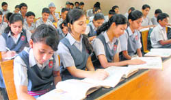  Students engrossed in their books at a school in Chandigarh.