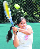 Gujarats Kiran Deep in action during the first round match of womens singles at CLTA, Sector 10, on Monday.