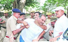 Cops use force on a striking teacher of Government Polytechnic in Sirsa on Monday
