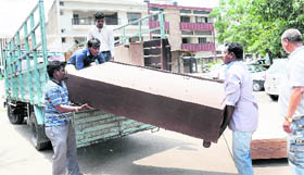 MC enforcement staff seize furniture of shopkeepers in Sector 34, Chandigarh, on Tuesday.