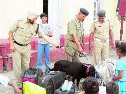 Safety check: Police checks the luggage of passengers at the Ambala Cantt Railway Station on Monday.