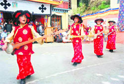 Tibetans perform a dance on Buddha Purnima in Shimla on Tuesday