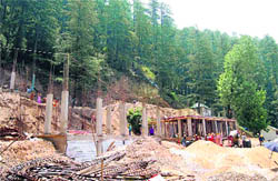 Work in progress below Kanlog in Shimla on Tuesday