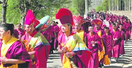 People take part in a procession on the occasion of Buddha Purnima in Leh on Tuesday.
