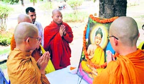 Buddhist students hold prayers at the University of Jammu on Tuesday.