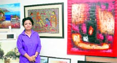 Vibha Ahuja with her curated paintings at Venus Art Gallery in Jalandhar.