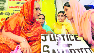 Sarabjits family on a fast in New Delhi on Tuesday. Sarabjit is in a Pakistani prison. He has been awarded the death sentence for acts of terrorism.