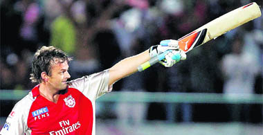 Kings XI Punjabs Adam Gilchrist waves to the crowd after completing his century against Royal Challengers in Dharamsala