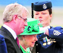 Britain's Queen Elizabeth II is greeted by Irelands Deputy PM Eamon Gilmore on her arrival in Dublin on Tuesday