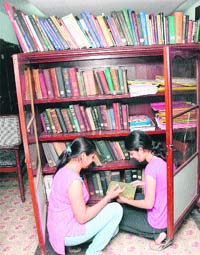 A cupboard (in the backdrop), almost seven decades old, preserved in Panjab Universitys AC Joshi Library