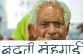 One of the CPI activists who protested against hike in fuel and milk prices in New Delhi on Wednesday. 