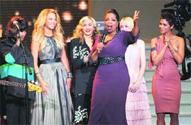 Oprah Winfrey speaks as she is surrounded by (from left) Patti LaBelle, Beyonc, Madonna, Dakota Fanning and Halle Berry during a star-studded double-taping of Surprise Oprah! A Farewell Spectacular, in Chicago on Tuesday