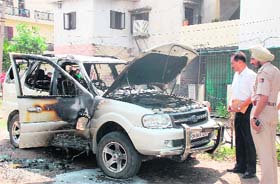 CHARRED The SUV that was set afire in Sector 45, Chandigarh, on Thursday