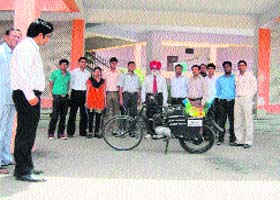 Students of mechanical engineering in the DAV College of Engineering and Technology, Kanina, pose with their newly designed motorcycle at Rewari