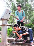 As water scarcity hits the Jammu region with the onset of summer, people use hand pumps to quench their thirs