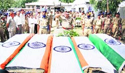 CRPF officers pay their last respects to the five jawans, who were killed in an IED blast at Dantewada, at the Jammu Airport