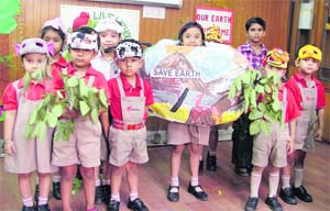 Pressing green cover Children of Radcliffe School celebrate Earth Week. 